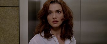 Movie still from “Constantine” (2005), directed by Francis Lawrence – A person wearing a white shirt; Close Up shot, Over the shoulder angle