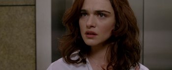 Movie still from “Constantine” (2005), directed by Francis Lawrence – A person wearing a white shirt; Close Up shot, Over the shoulder angle