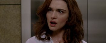 Movie still from “Constantine” (2005), directed by Francis Lawrence – A person with long red hair; Close Up shot, Over the shoulder angle