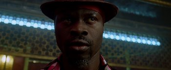 Movie still from “Constantine” (2005), directed by Francis Lawrence – A person wearing a hat; Close Up shot, Low angle