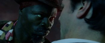 Movie still from “Constantine” (2005), directed by Francis Lawrence – A man's face with a hat on; Close Up shot, Over the shoulder angle