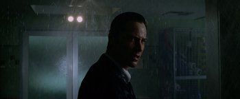 Movie still from “Constantine” (2005), directed by Francis Lawrence – A person standing in the rain; Close Up shot, Low angle