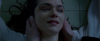 Movie still from “Constantine” (2005), directed by Francis Lawrence – A woman getting her face washed in the shower; Close Up shot, Over the shoulder angle