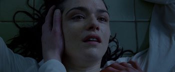 Movie still from “Constantine” (2005), directed by Francis Lawrence – A person holding their head with one hand; Close Up shot, High angle