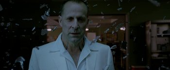 Movie still from “Constantine” (2005), directed by Francis Lawrence – A person wearing a white shirt; Close Up shot, Low angle
