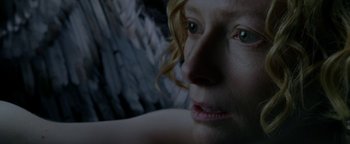 Movie still from “Constantine” (2005), directed by Francis Lawrence – A woman's face with green eyes; Extreme Close Up shot, Overhead angle