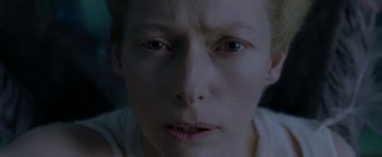 Movie still from “Constantine” (2005), directed by Francis Lawrence – A person's face in a dark room; Extreme Close Up shot, Overhead angle