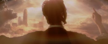 Movie still from “Constantine” (2005), directed by Francis Lawrence – A man in a suit looking out a window at the sky; Close Up shot, Low angle