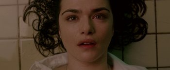 Movie still from “Constantine” (2005), directed by Francis Lawrence – A woman's face as she lies on a bed; Close Up shot, Overhead angle
