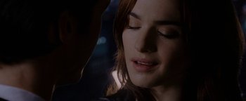 Movie still from “Constantine” (2005), directed by Francis Lawrence – A person with their eyes closed; Close Up shot, Over the shoulder angle