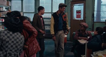 Movie still from “Cooley High” (1975), directed by Michael Schultz – A group of young men standing next to each other; Medium shot, Over the shoulder angle