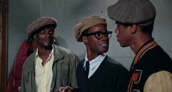 Movie still from “Cooley High” (1975), directed by Michael Schultz – A group of men standing next to each other wearing hats; Medium shot, Over the shoulder angle