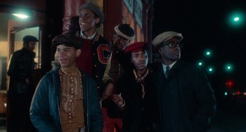 Movie still from “Cooley High” (1975), directed by Michael Schultz – A group of men standing next to each other in hats; Medium shot, Low angle