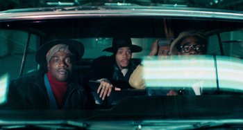 Movie still from “Cooley High” (1975), directed by Michael Schultz – A group of men sitting in the back of a car; Medium shot, High angle