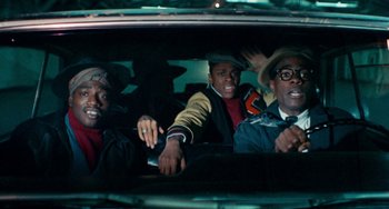 Movie still from “Cooley High” (1975), directed by Michael Schultz – A group of people riding in a car at night; Medium shot, Low angle