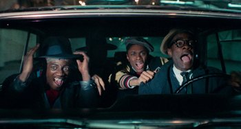 Movie still from “Cooley High” (1975), directed by Michael Schultz – A group of people in a car at night; Medium shot, Low angle