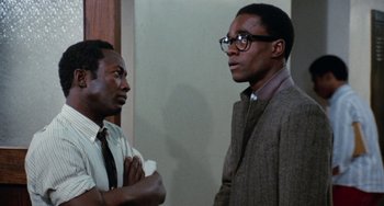 Movie still from “Cooley High” (1975), directed by Michael Schultz – A couple of men standing next to each other; Medium shot, Low angle