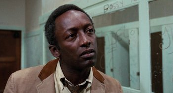 Movie still from “Cooley High” (1975), directed by Michael Schultz – A person wearing a suit and tie; Close Up shot, Low angle