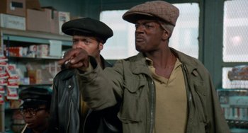 Movie still from “Cooley High” (1975), directed by Michael Schultz – A couple of men standing next to each other; Medium shot, Low angle