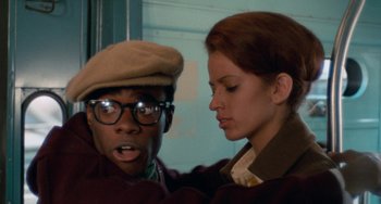 Movie still from “Cooley High” (1975), directed by Michael Schultz – A man and a woman standing next to each other; Close Up shot, Low angle