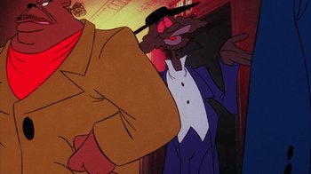Movie still from “Coonskin” (1974), directed by Ralph Bakshi – A man in a suit and a hat standing in front of another man in a suit and a hat; Medium shot, Low angle