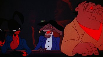 Movie still from “Coonskin” (1974), directed by Ralph Bakshi – A group of people sitting in front of a fire; Medium shot, Low angle