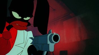 Movie still from “Coonskin” (1974), directed by Ralph Bakshi – A cartoon of a cat holding a gun in his hand; Close Up shot, Low angle