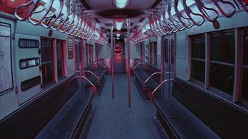 Movie still from “Coonskin” (1974), directed by Ralph Bakshi – A subway train car with red lights on it's side; Wide shot, High angle
