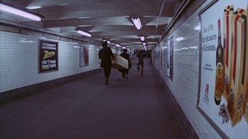 Movie still from “Coonskin” (1974), directed by Ralph Bakshi – A group of people walking down a long hallway; Extreme Wide shot, High angle