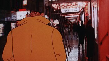 Movie still from “Coonskin” (1974), directed by Ralph Bakshi – A person walking down a street with a crowd of people walking down the sidewalk; Extreme Close Up shot, Low angle
