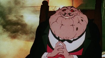 Movie still from “Coonskin” (1974), directed by Ralph Bakshi – An old man with a beard is sitting in a chair with his hands clasped together; Close Up shot, Low angle