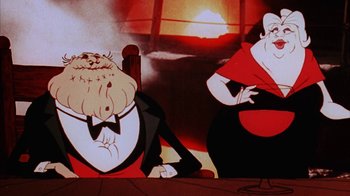 Movie still from “Coonskin” (1974), directed by Ralph Bakshi – An animated picture of a man and a woman sitting at a table; Close Up shot, Low angle