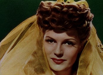 Movie still from “Cover Girl” (1944), directed by Charles Vidor – A person wearing a veil; Close Up shot, Low angle