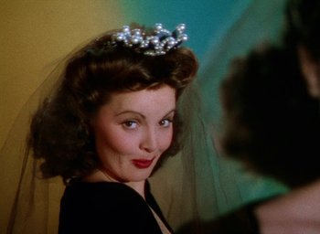 Movie still from “Cover Girl” (1944), directed by Charles Vidor – A person wearing a tiara; Close Up shot, Low angle