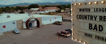 Movie still from “Crazy Heart” (2009), directed by Scott Cooper – An aerial view of an outdoor movie theater; Extreme Wide shot, High angle