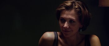 Movie still from “Crazy Heart” (2009), directed by Scott Cooper – A person with short brown hair; Close Up shot, Over the shoulder angle