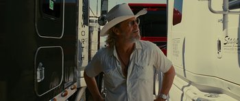 Movie still from “Crazy Heart” (2009), directed by Scott Cooper – A man in a cowboy hat standing in front of a truck; Close Up shot, Low angle