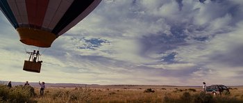 Movie still from “Crazy Heart” (2009), directed by Scott Cooper – A view of a field and a sky with clouds; Extreme Wide shot, Low angle