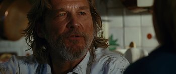 Movie still from “Crazy Heart” (2009), directed by Scott Cooper – A person with long hair and a beard; Close Up shot, Over the shoulder angle