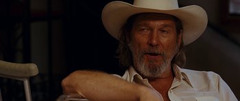 Movie still from “Crazy Heart” (2009), directed by Scott Cooper – A person wearing a cowboy hat; Close Up shot, Over the shoulder angle