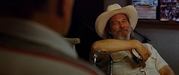 Movie still from “Crazy Heart” (2009), directed by Scott Cooper – An older man wearing a white cowboy hat; Close Up shot, Over the shoulder angle