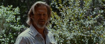 Movie still from “Crazy Heart” (2009), directed by Scott Cooper – An older man with long white hair and a beard; Close Up shot, Low angle