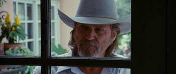 Movie still from “Crazy Heart” (2009), directed by Scott Cooper – A person wearing a cowboy hat; Close Up shot, Over the shoulder angle