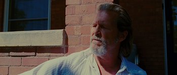 Movie still from “Crazy Heart” (2009), directed by Scott Cooper – An older man with a beard is looking up; Close Up shot, Low angle