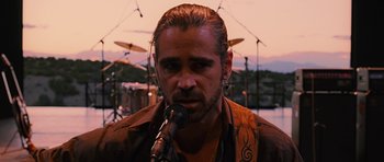 Movie still from “Crazy Heart” (2009), directed by Scott Cooper – A person holding a microphone; Close Up shot, Over the shoulder angle