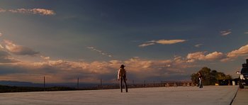 Movie still from “Crazy Heart” (2009), directed by Scott Cooper – A person standing on top of a snow covered field; Extreme Wide shot, Low angle