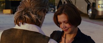 Movie still from “Crazy Heart” (2009), directed by Scott Cooper – A man and a woman standing next to each other on the street; Close Up shot, Over the shoulder angle