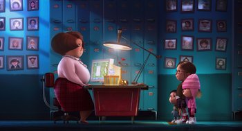 Movie still from “Despicable Me” (2010), directed by Pierre Coffin – An illustration of a woman sitting in front of a computer; Wide shot, Over the shoulder angle