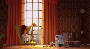 Movie still from “Despicable Me” (2010), directed by Pierre Coffin – An animated scene of a woman sitting in a chair; Wide shot, High angle