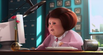 Movie still from “Despicable Me” (2010), directed by Pierre Coffin – An animated woman is sitting at a computer keyboard; Medium shot, High angle
